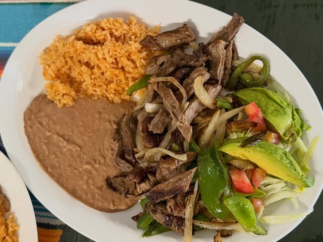 Fajita beef plate with rice, beans and avocado